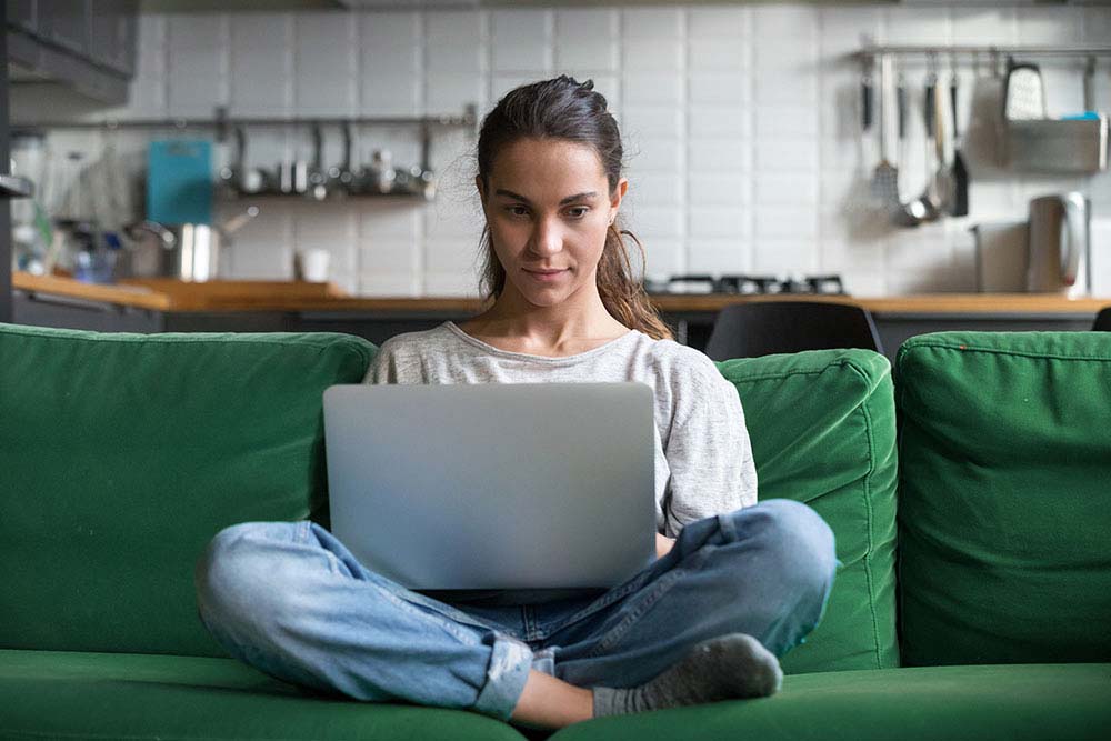 Header: Girl on green couch 1000x